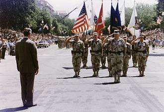 Schwarzkopf is met by then-President George Bush during a homecoming parade for troops returning from the Gulf War in 1991.