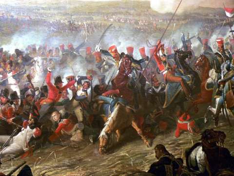 British 10th Hussars of Vivian's Brigade (red shakos – blue uniforms) attacking mixed French troops, including a square of Guard grenadiers (left, middle distance) in the final stages of the battle