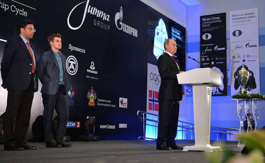 Carlsen on-stage at the closing ceremony of the 2014 World Chess Championship in Sochi, Russia. Vishy Anand and Vladimir Putin also pictured.