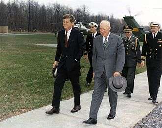 Former President Dwight D. Eisenhower meets with President John F. Kennedy at Camp David
