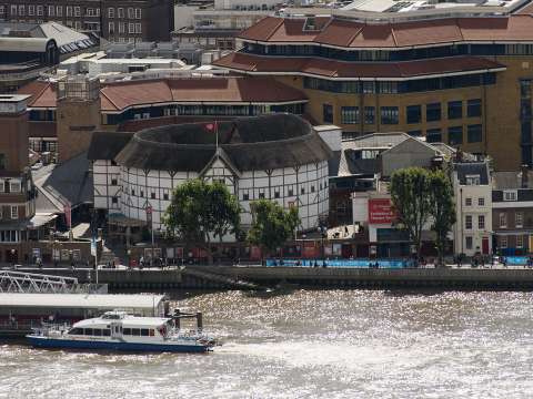 The reconstructed Globe Theatre on the south bank of the River Thames in London