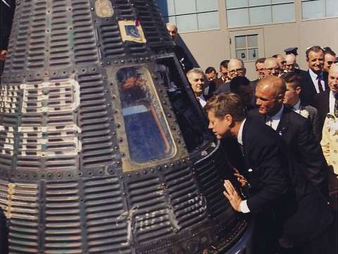 Accompanied by astronaut John Glenn, Kennedy inspects the Project Mercury capsule Friendship 7, February 23, 1962