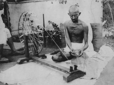 Gandhi spinning yarn, in the late 1920s
