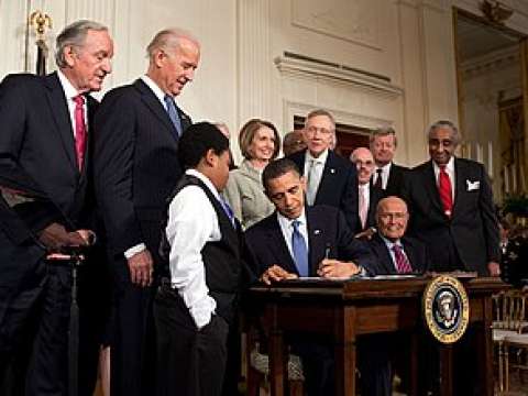 Obama signs the Patient Protection and Affordable Care Act at the White House, March 23, 2010.