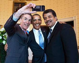Tyson, Bill Nye, and U.S. President Barack Obama take a selfie at the White House, 2014