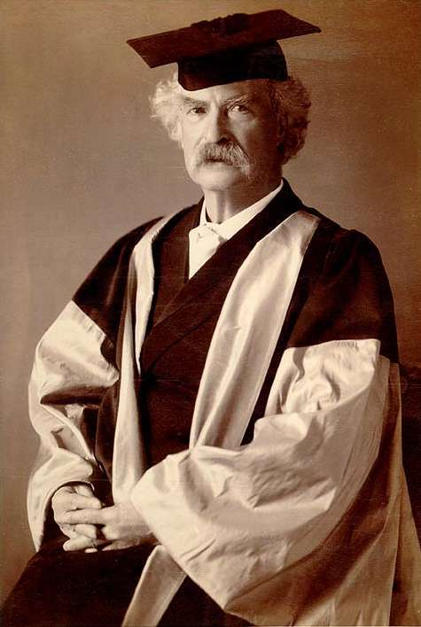 Twain in his gown (scarlet with grey sleeves and facings) for his D.Litt. degree, awarded to him by Oxford University