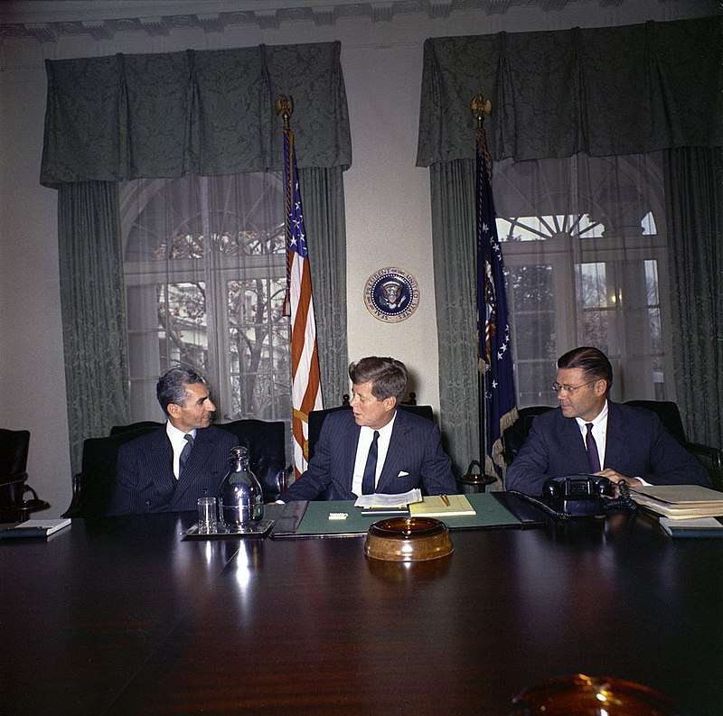 Shah Mohammad Reza Pahlavi of Iran, Kennedy, and U.S. Defense Secretary Robert McNamara in the White House Cabinet Room on April 13, 1962