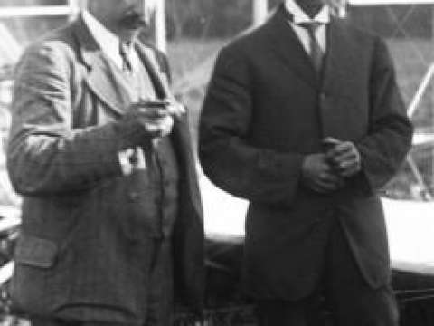 Hart O. Berg (left), the Wrights' European business agent, and Wilbur at the flying field near Le Mans.