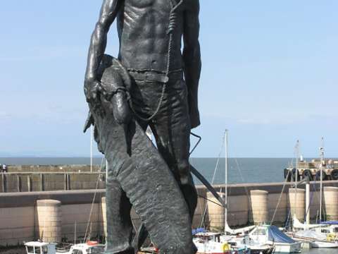 A statue of the Ancient Mariner at Watchet Harbour, Somerset, England