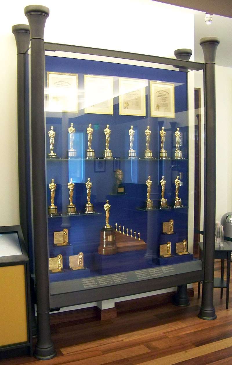 Display case in the lobby of The Walt Disney Family Museum showing many of the Academy Awards won by Disney