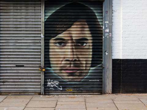 Graffito depicting the film version of the No Country for Old Men character Anton Chigurh in London