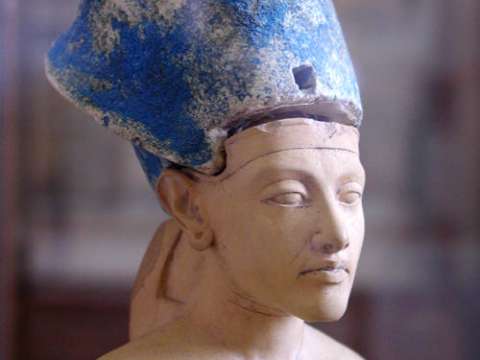 Small statue of Akhenaten wearing the Egyptian Blue Crown of War.