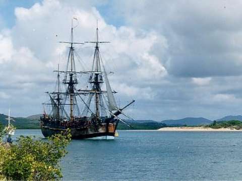 Endeavour replica in Cooktown, Queensland harbour – anchored where the original Endeavour was beached for seven weeks in 1770