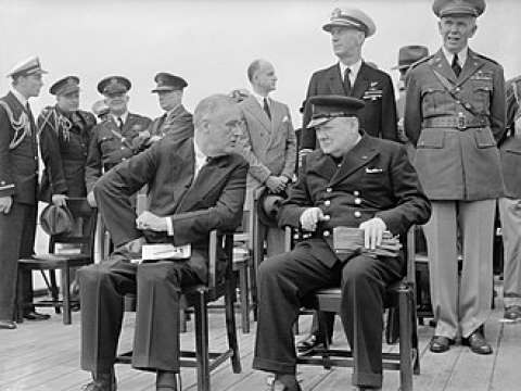 Churchill and Roosevelt seated on the quarterdeck of HMS Prince of Wales for a Sunday service during the Atlantic Conference, 10 August 1941