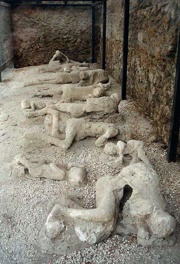 Plaster casts of the casualties from pyroclastic surges, whose remains vanished, leaving cavities in the pumice at Pompeii