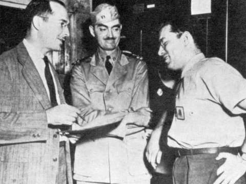 Robert A. Heinlein and L. Sprague de Camp with Asimov (right), Philadelphia Navy Yard, 1944