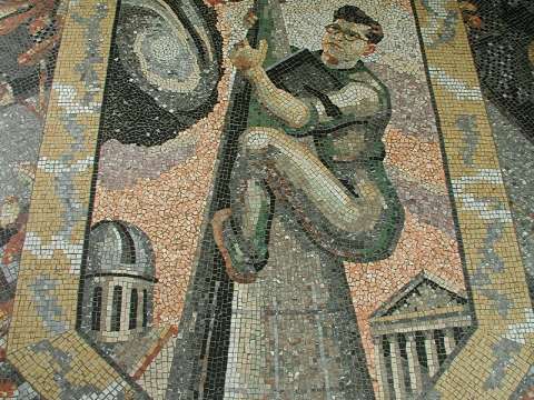 A mosaic by Boris Anrep depicting Fred Hoyle as a steeplejack climbing to the stars, with a book under his arm, in the National Gallery, London.