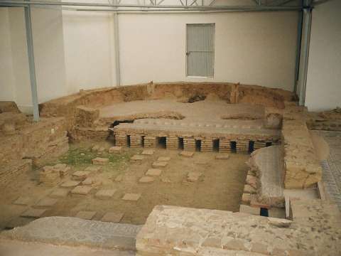 Ruins of the hypocaust under the floor of a Roman villa. The part under the exedra is covered.