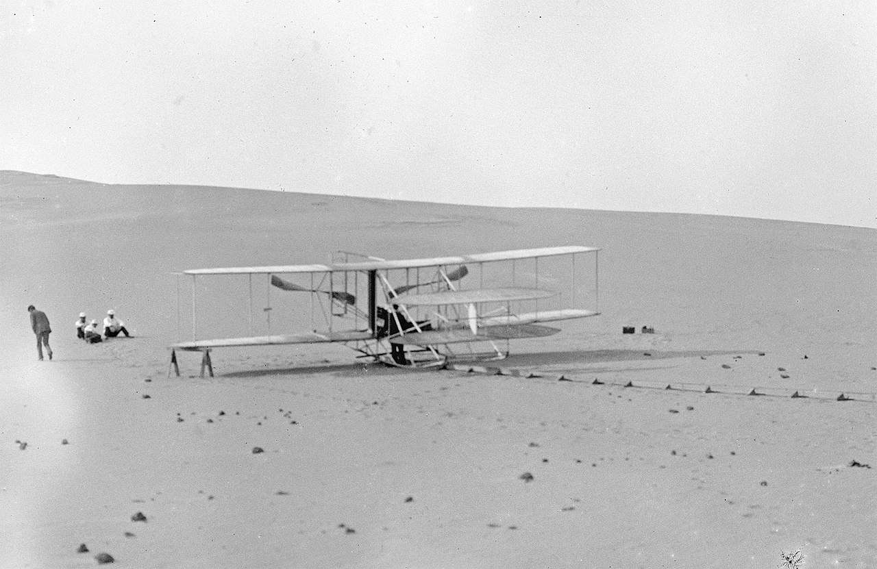 The modified 1905 Flyer at the Kill Devil Hills in 1908, ready for practice flights. Note there is no catapult derrick; all takeoffs were used with the monorail alone.