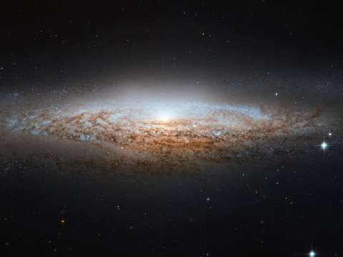 NGC 2683 is an unbarred spiral galaxy discovered by William Herschel on 5 February 1788