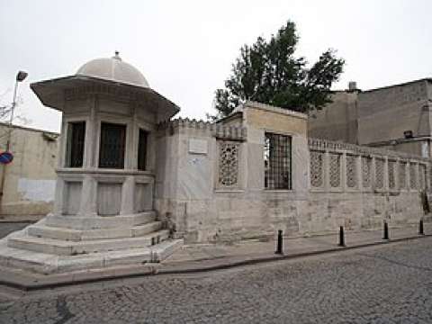 Sinan's octagonal water dispenser on the left next to his tomb behind the iron grill on the right, Fatih district of Istanbul