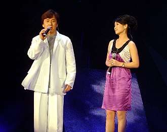 Chan and Qin Hailu singing in Shanghai, China in August 2006
