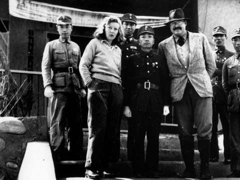 Hemingway with his third wife Martha Gellhorn, posing with General Yu Hanmou, Chungking, China, 1941