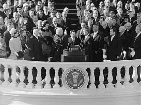 Chief Justice Earl Warren administers the presidential oath of office to John F. Kennedy at the Capitol, January 20, 1961.