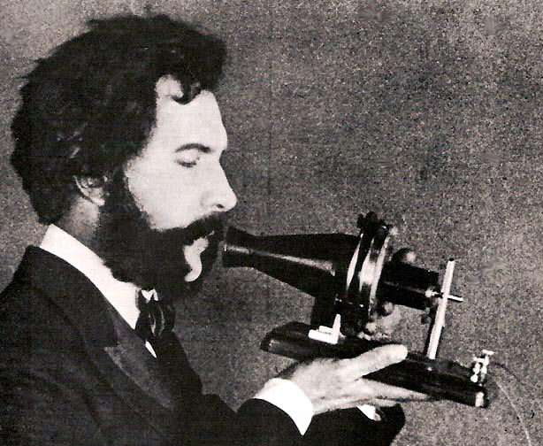 An actor playing Bell in a 1926 film holds Bell's first telephone transmitter