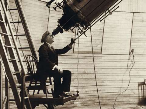 Percival Lowell in 1914, observing Venus in the daytime with the 24-inch (61 cm) Alvan Clark & Sons refracting telescope at Flagstaff, Arizona