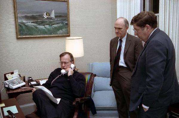 President Bush speaks on the telephone regarding Operation Just Cause with Sununu and Brent Scowcroft, 1989.