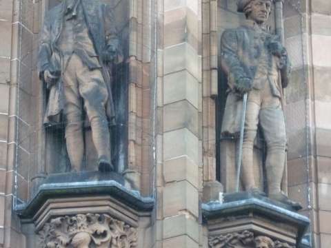 Statues of David Hume and Adam Smith by David Watson Stevenson on the Scottish National Portrait Gallery in Edinburgh