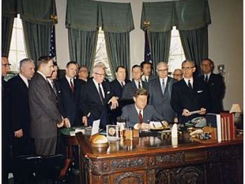 Kennedy signing the Manpower Development and Training Act, March 1962