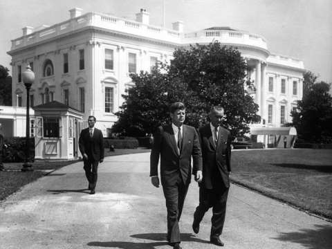 President Kennedy and Vice President Johnson walking on the White House grounds