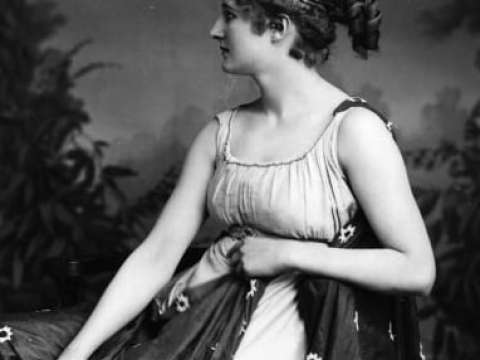 An actress, possibly Mary Anderson, in the title role of the play Hypatia, c. 1900.